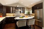 Fully equipped kitchen with necessary cooking utensils, granite countertops 